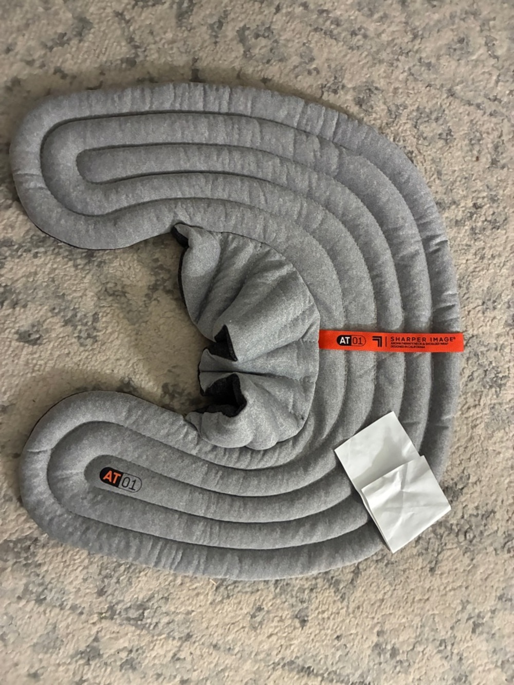 Sharper Image Grey Neck Pillow with Orange Brand Tag